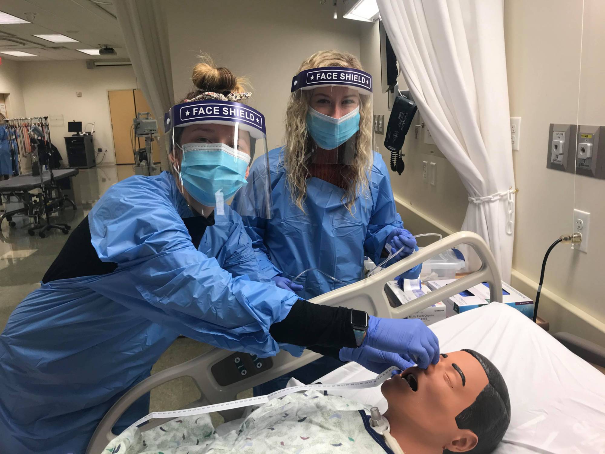 Students practicing the nasogastric tube insertion on a manikin